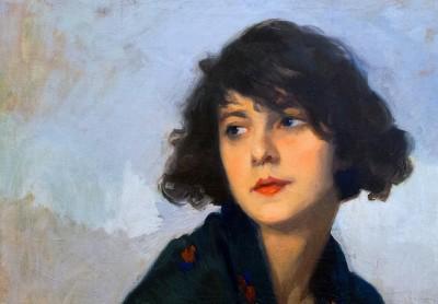 Woman with green scarf in quiet outdoors