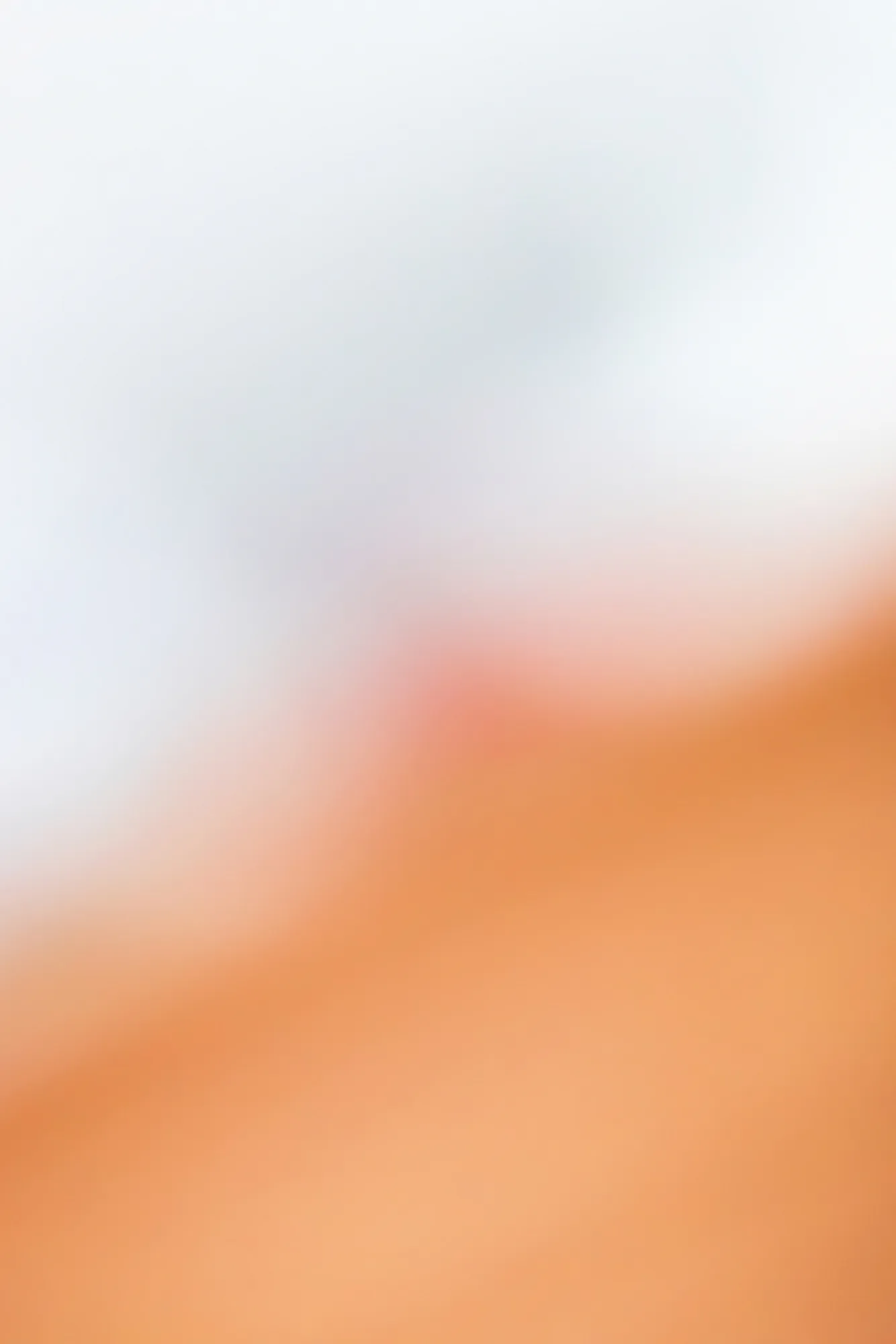 Blurred outdoor gradient in pastel pink and orange